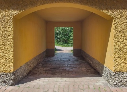 Yellow archway, Borstei, heritage-protected residential development, Munich, Bavaria, Germany