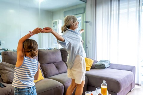 Grandmother and young granddaughter bonding, forming a strong family connection while enjoying a