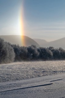 Fog and parhelion over the frozen river Glomma (Glåma), Alvdal, Hedmark, Innlandet, Norway,