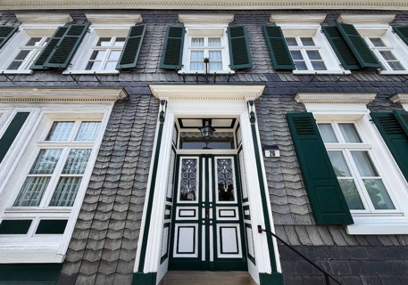 Beautiful front door with slate façade and green shutters, Bergischer Dreiklang, Hückeswagen,