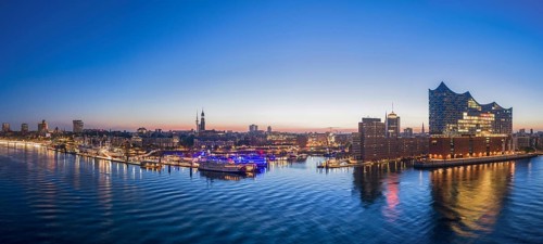 Panorama aerial view of Landungsbrücken (Jan-Fedder-Promenade) at sunrise on the Elbe with Elbe