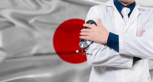Japanese national health system, Medical professional holding sthetoscope isolated