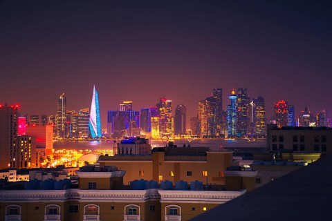 Doha, Qatar - january 8th, 2026: residential area and Doha business hub skyline at night. Iconic