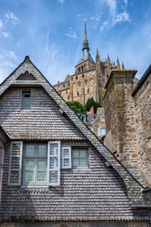 Medieval alley and traditional wooden shingle houses within the fortress walls of Mont-Saint-Michel