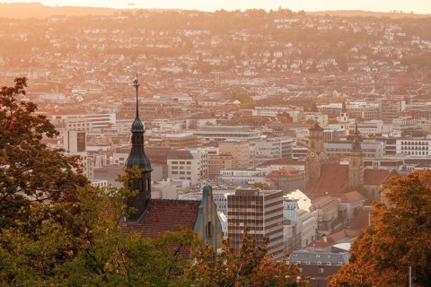 30.09.2018: Stuttgart city panorama at sunset with Collegiate Church and St. Leonhard Church towers