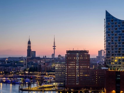 Aerial view of the sunrise on the Elbe with Elbe Philharmonic Hall, St Michael's Church (Michel)