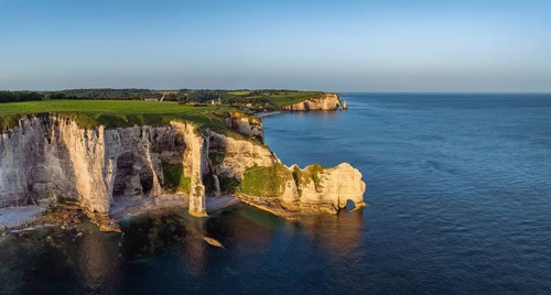 Aerial view, panorama of the Porte d'Amont rock formation, Falaise d'Amont shortly after sunrise, a