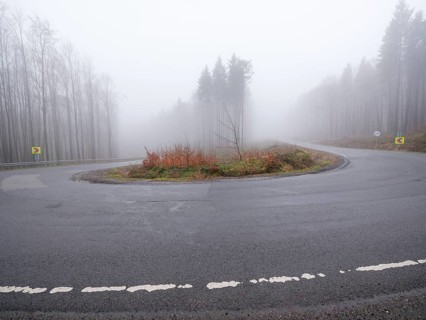 Sweeping a mountain pass in fog, Maramures, Romania
