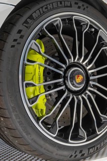 Close-up of a Porsche wheel with green brake, Porsche Museum, Stuttgart, Germany