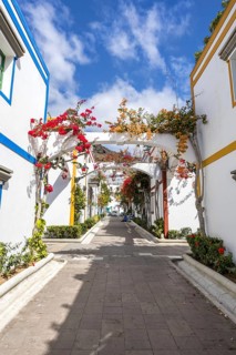 Puerto de Mogan typical colorful houses with flowers on Gran Canaria island vacation trip in Puerto