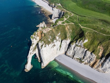 Aerial view of the Porte d'Aval rock formation, a landmark on the chalk coast with the distinctive