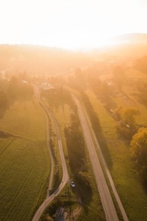 Road leads through a quiet landscape in the golden light of sunset, Deufringen, Aidlingen,