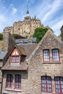 Medieval alley and traditional stone houses within the fortress walls of Mont-Saint-Michel. In the