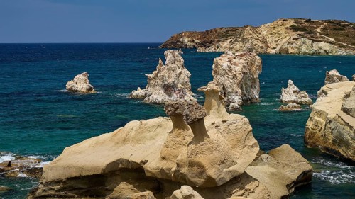 View of rocks and cliffs in the deep blue sea, Aspragremna, White Cliffs, Mavorspilia Beach,