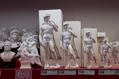 Statues of David by Michelangelo in various sizes for tourists as souvenirs, Florence, Tuscany,