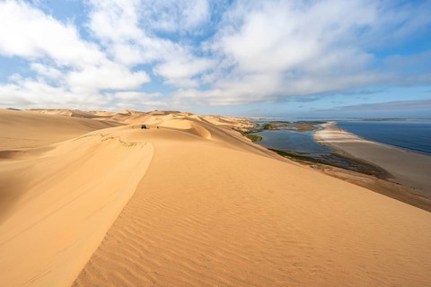 Sand dunes and sea, Atlantic coast and sandy desert with sea of dunes, view of lagoon at Sandwich