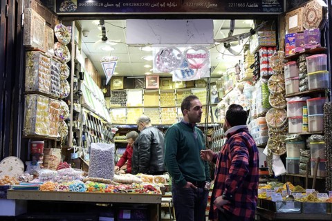 Syrians shop at the historic Al-Hamidiyah Bazaar adjacent to the Umayyad Mosque during the early