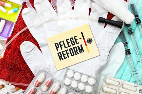 Note with the words Care reform in front of medical articles, photo montage +++ editorial use only