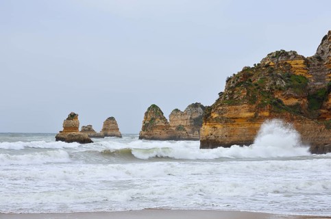 Rocky coast in the surf, Praia Dona Ana, Lagos, Algarve, Portugal
