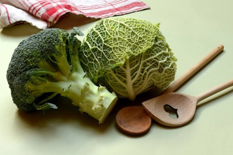 Savoy cabbage and broccoli with cooking spoon