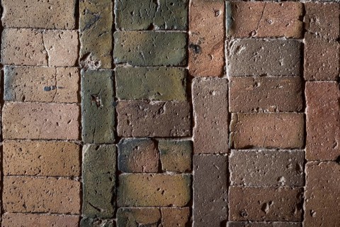 Detailed view, floor with old earth-colored bricks crisscrossed by cracks, church, Husby Church,