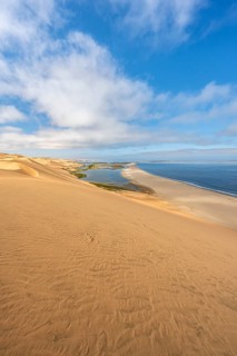 Sand dunes and sea, Atlantic coast and sandy desert with sea of dunes, view of lagoon at Sandwich