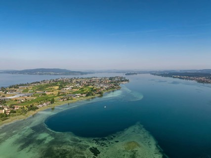 Aerial view of the island of Reichenau in western Lake Constance, Untersee, on the horizon the Höri