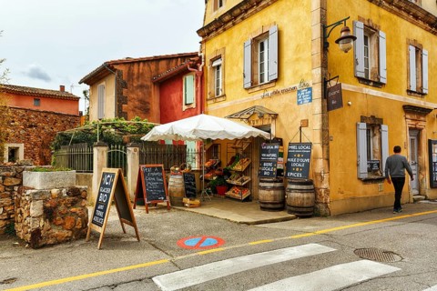 Shop selling local specialities such as wine, honey and olive oil, picturesque ochre-coloured
