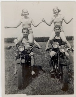 Bathing, swimwear, leisure, summer, fun, two woman sitting on the shoulders of men on motorbikes,