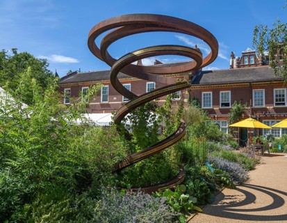 Steel spiral sculpture with names of head gardeners in gardens at Chelsea Physic Garden, London,