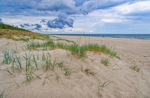Dunes on the Baltic Sea beach after rain on a public sandy beach. Grzybowo, West Pomerania, Poland