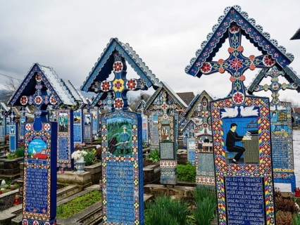 Colourfully painted wooden crosses in the cheerful Cimitirul Vesel cemetery, Sapân?a, Maramure?,