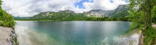 Landscape of Lake Offensee after rain when the sun comes through the clouds in spring,