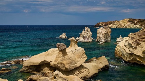 Rough rocks by the sea with deep shades of blue and dramatic scenery, Aspragremna, White Cliffs,