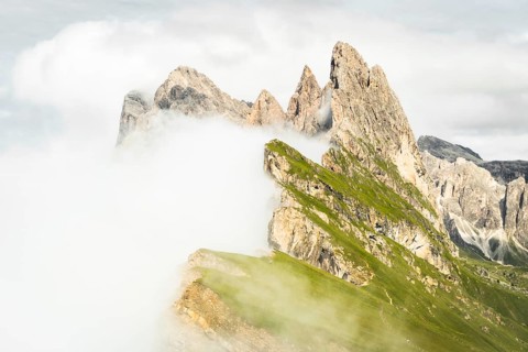 Dramatic Seceda mountain peaks scenic view Dolomites Alps Italy summer daytime green alpine meadow