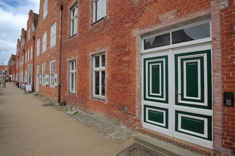 Row of red brick houses, front door with patterns and decorations, Dutch Quarter, Potsdam,