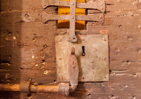 Castle of a historic wooden door of a prison cell in the Ducal Palace, Venice, Veneto, Italy