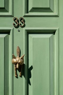 Light green, coffered door with fox shaped brass door knocker and house number 33, Chelsea, London,