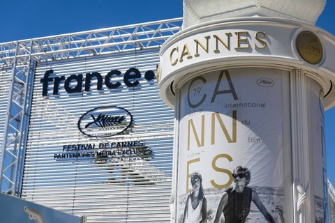 Advertising column with a poster of the Film Festival in front of the opening of the 79th Cannes