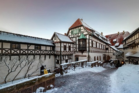 Snowy timber-framed courtyard at dusk, The Wartburg near Eisenach in Thuringia