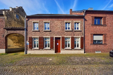 Old town, historic city center, historic brick buildings, façade with windows and shutters,
