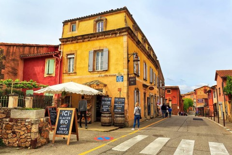 Shops selling local specialities such as wine, honey and olive oil, picturesque ochre-coloured