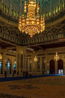 Dome and illuminated chandelier in the Sultan Qaboos Mosque, Muscat, Arabian Peninsula, Sultanate