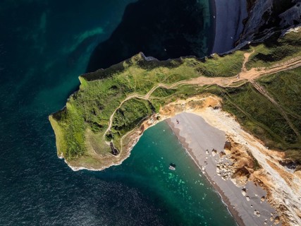 Aerial view, top down view of the distinctive Pointe de la Courtine ledge in the evening sun,