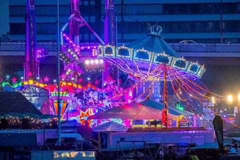 Rhine fair in the Rheinwiesen in Düsseldorf-Oberkassel, rides in the evening, with lots of