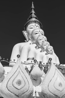 Five-headed Buddha statue, black and white photo, Wat Phra That Sorn Kaew Buddhist temple complex,
