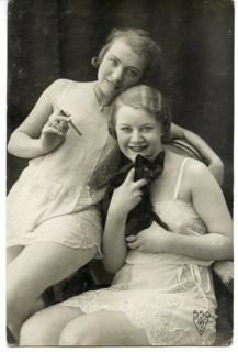 Femmes, lingerie, erotic, cat, art deco, two woman in nightgowns smile joyfully, one holding a