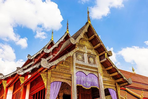Decorated roof of a public prayer hall in the Wat Phra Singh Buddhist temple complex, Chiang Mai