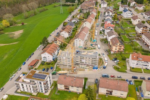 Scenic shot of a residential area with construction and surrounding nature, residential building