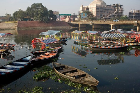 Tourboats moored on a river in Raipur (Chhattisgarh, India) . River name is Kharun. The river is